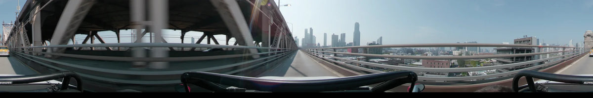 The Manhattan skyline emerges ahead as a car crosses the Queensboro Bridge in New York, United States, on a clear spring day.